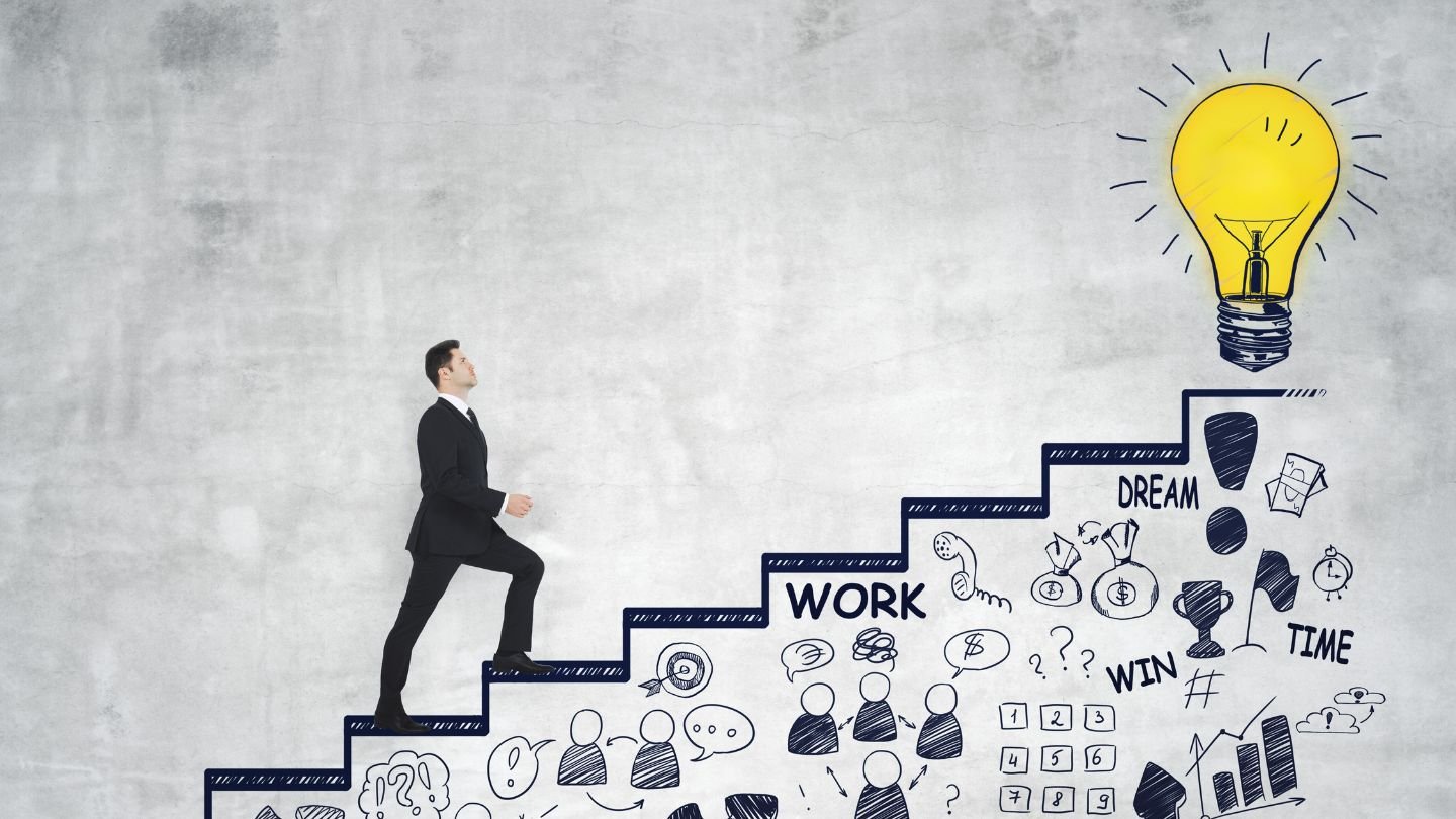 IT Career Acceleration - Business professional climbing stairs toward lightbulb representing career growth and innovation