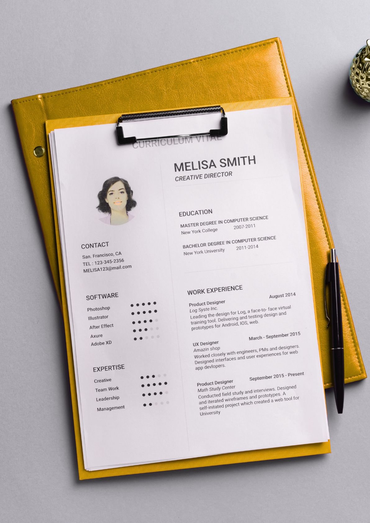 Professional resume on yellow clipboard showing CV format and skills