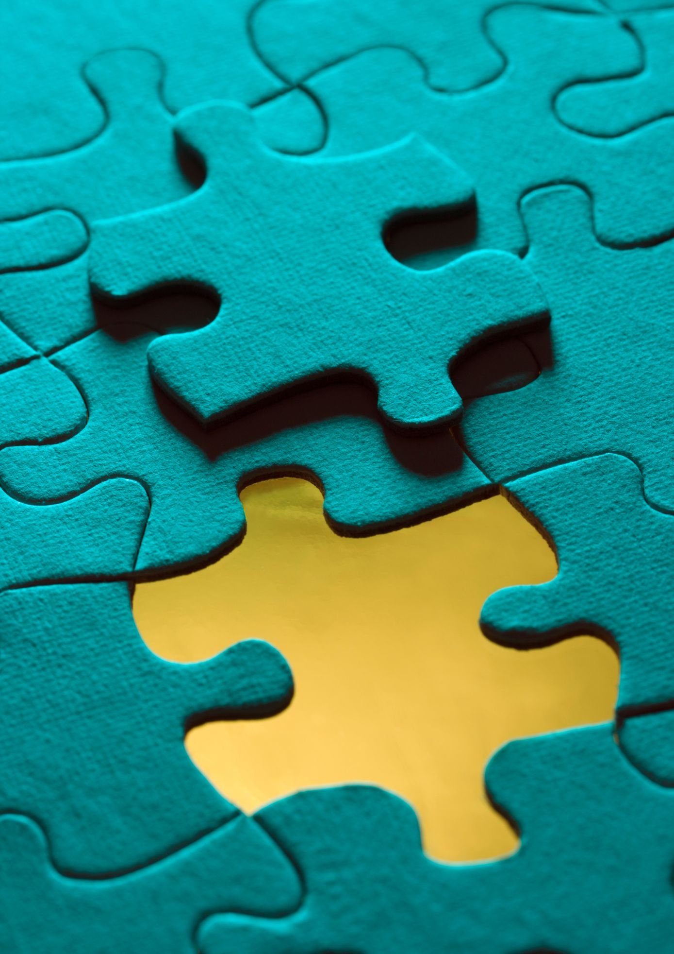 Puzzle pieces fitting together representing company fit